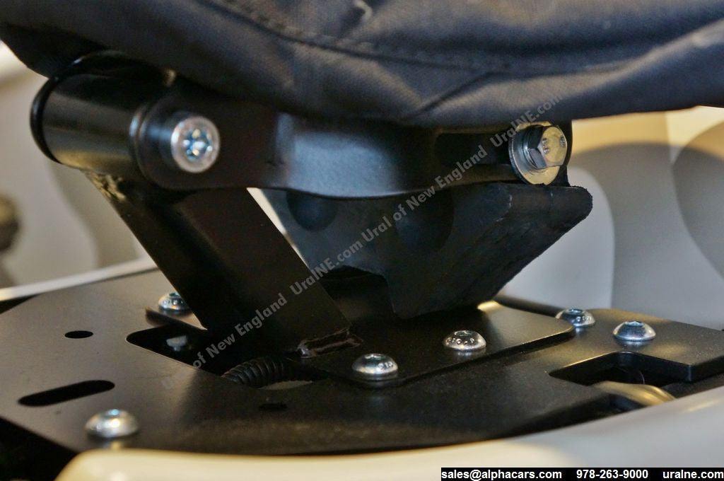 This photo shows the tractor seat in stock configuration, without the spacer, to illustrate the difference.