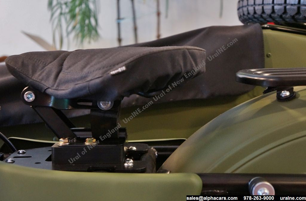 This photo shows the tractor seat in stock configuration, without the spacer, to illustrate the difference.