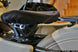 This photo shows the tractor seat in stock configuration, without the spacer, to illustrate the difference.
