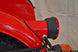 This photo shows the Retro Rear Motorcycle Light Adapter, as part of the complete Retro Rear Light Kit (including gasket and light assembly).
